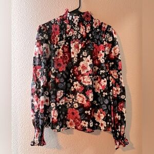 Women’s ruffled neck and ruffled cuff blouse